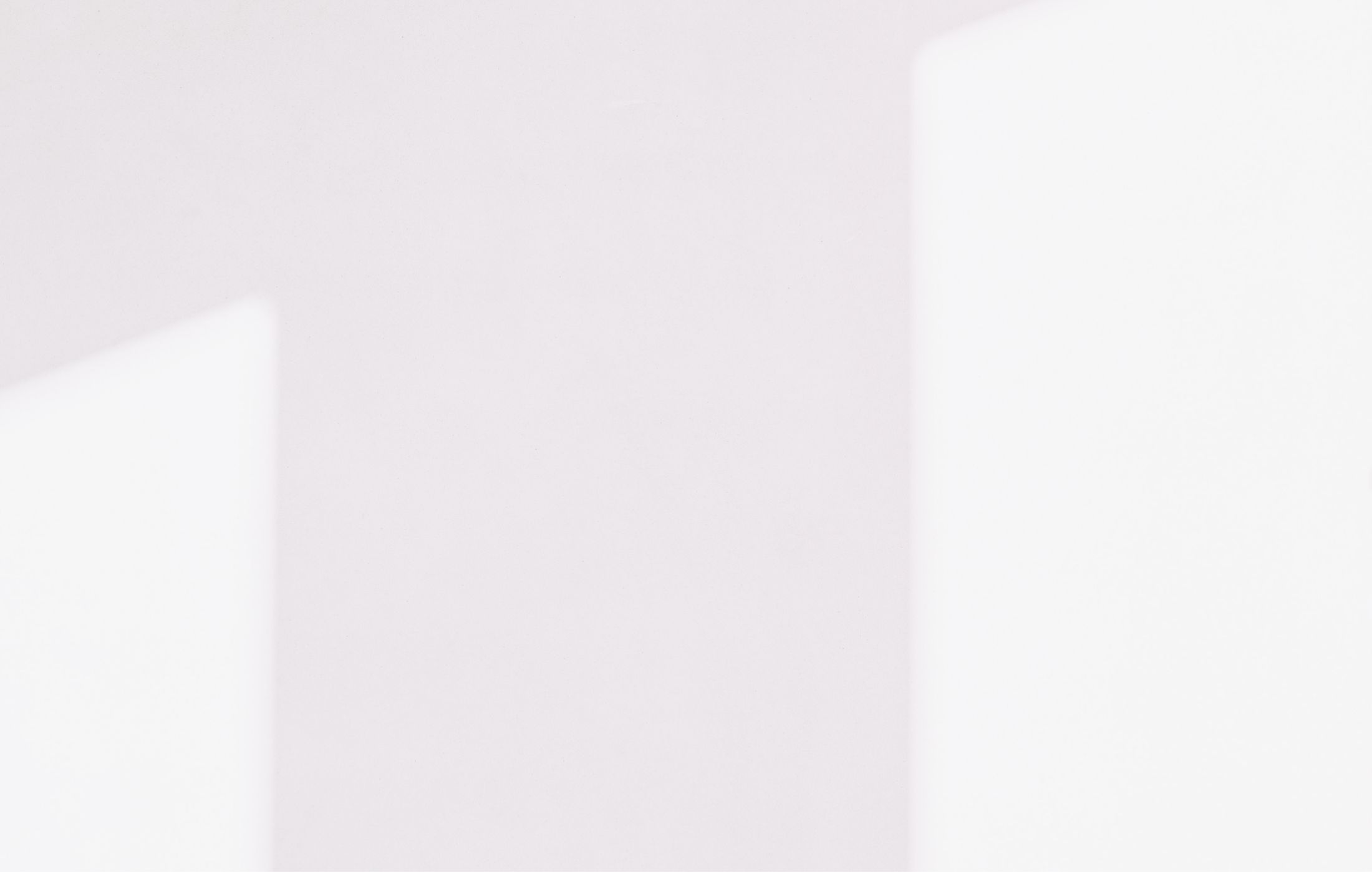 Abstract shapes on a soft, light background.