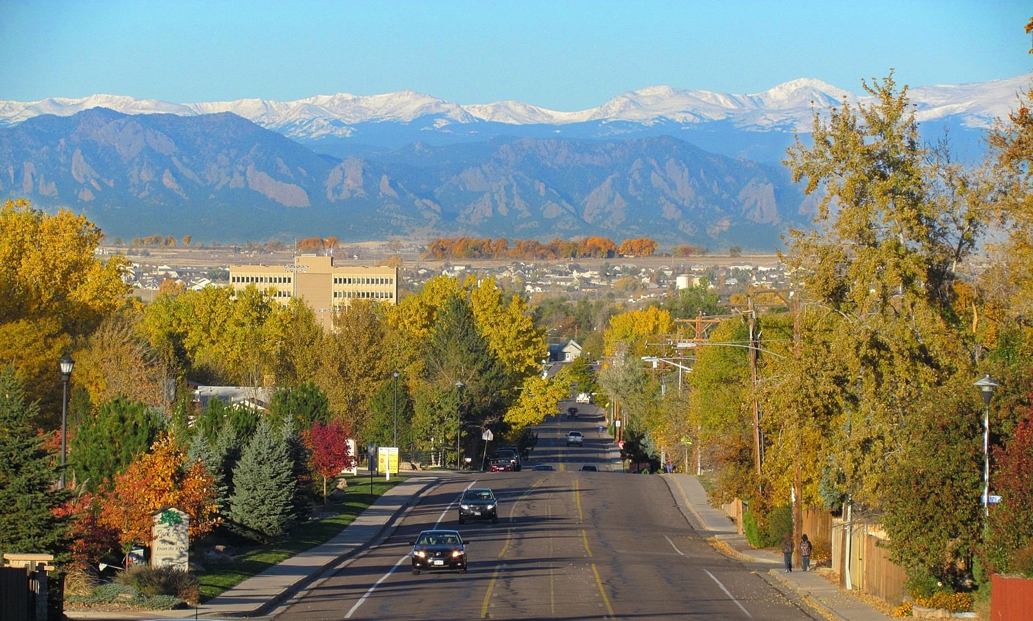 Aerial view of city with highways and buildings.
