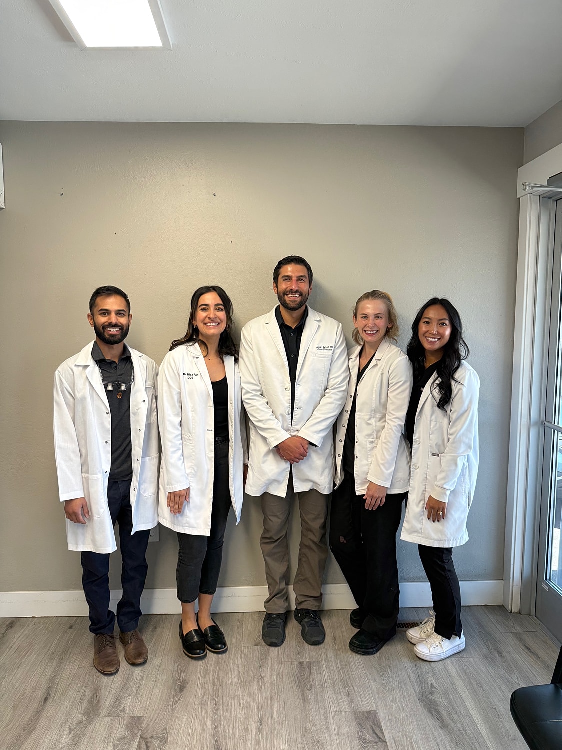 Modern dental office interior with examination chair.
