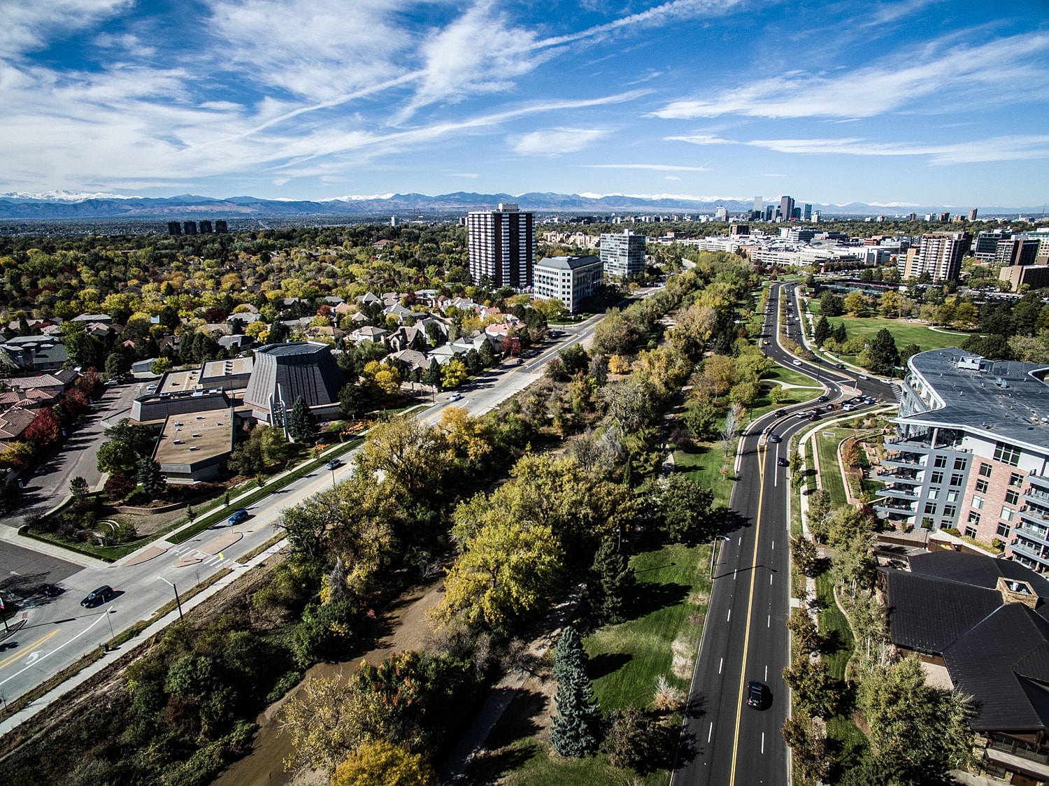 Aerial view of city with highways and buildings.