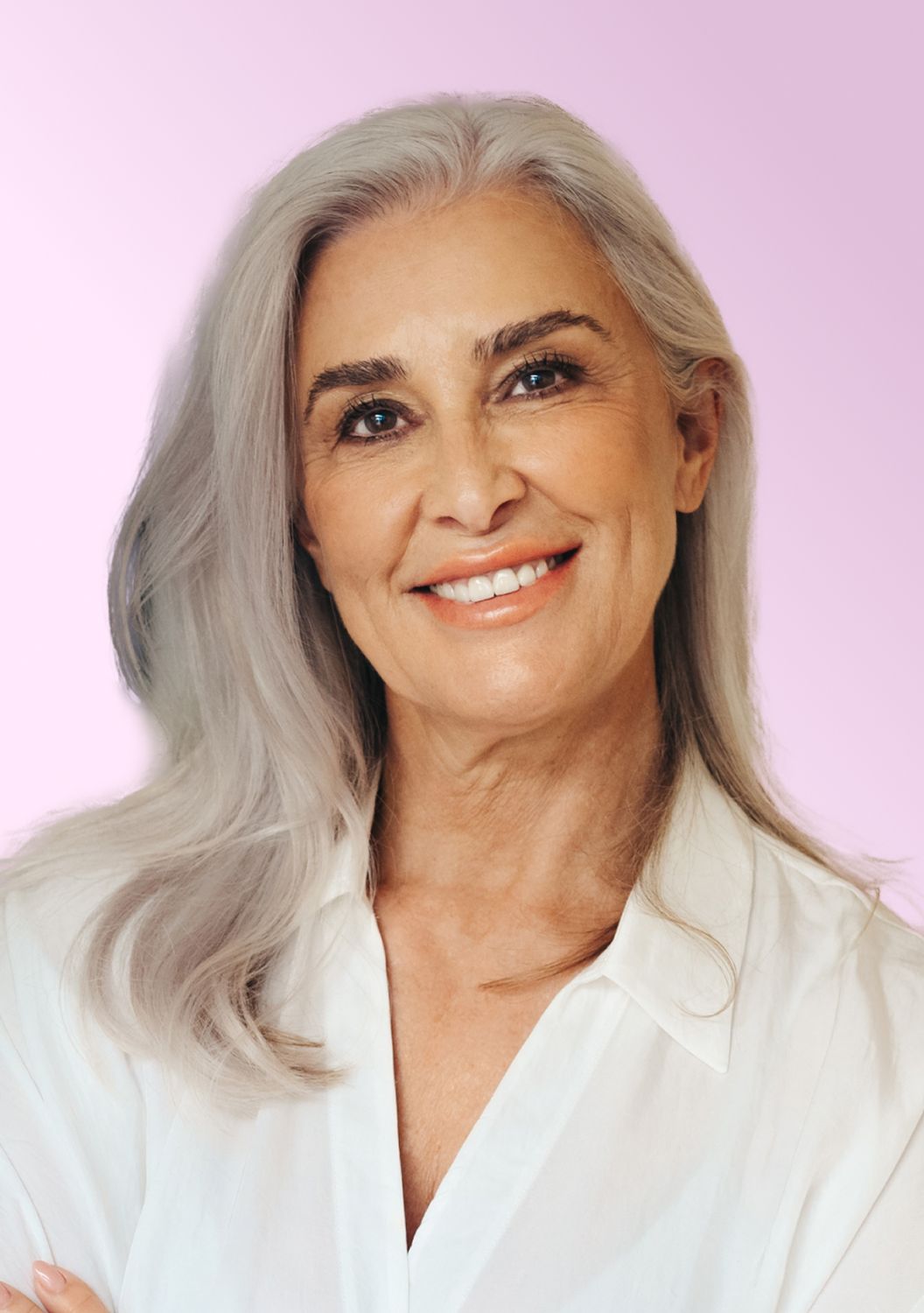 Smiling older woman with long gray hair.