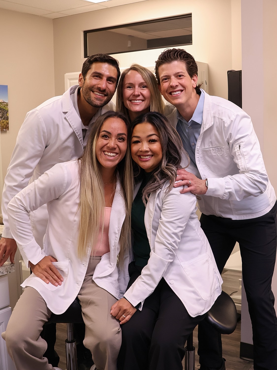 Modern dental office interior with examination chair.