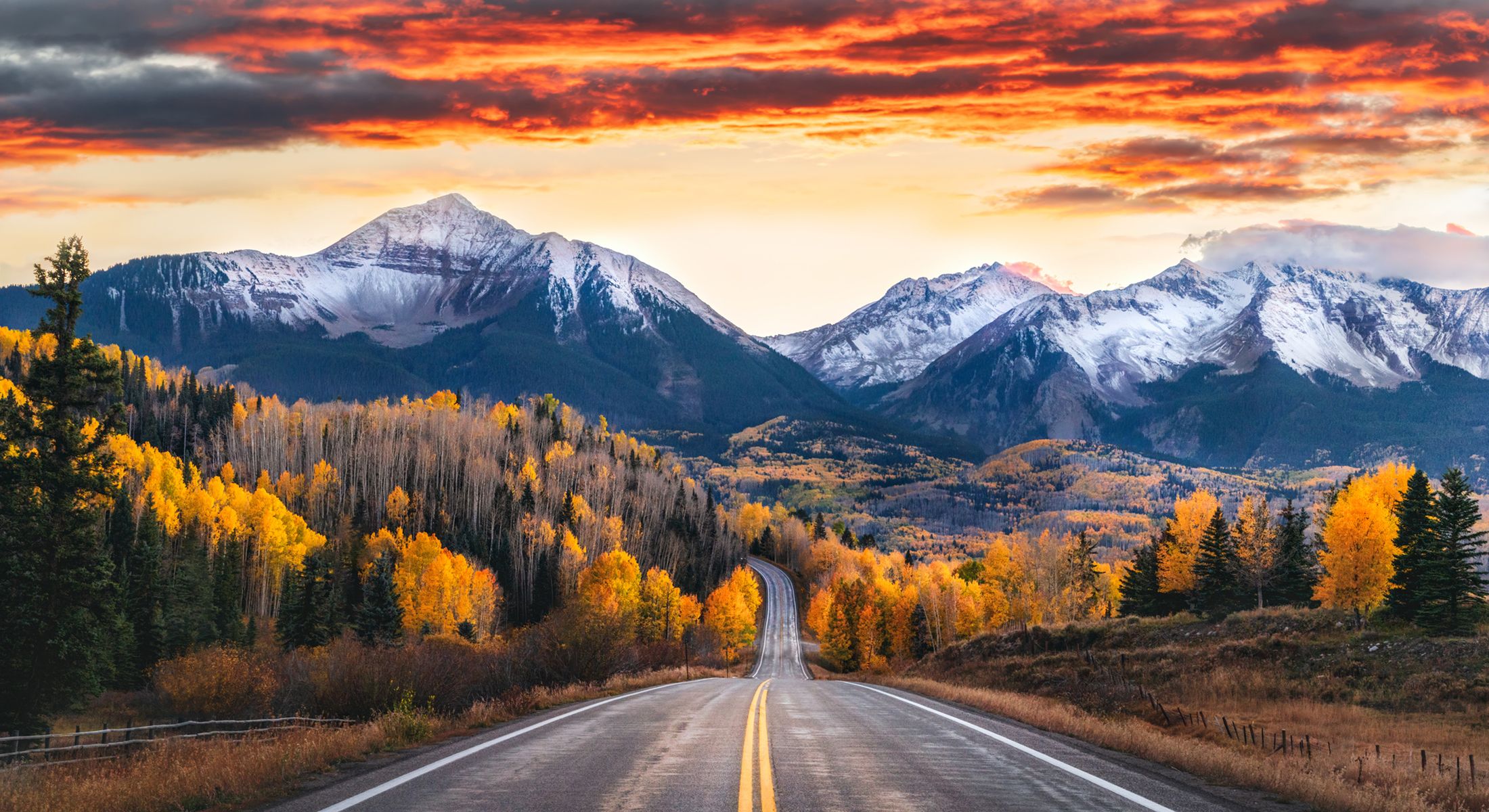 Scenic road through colorful autumn mountains.