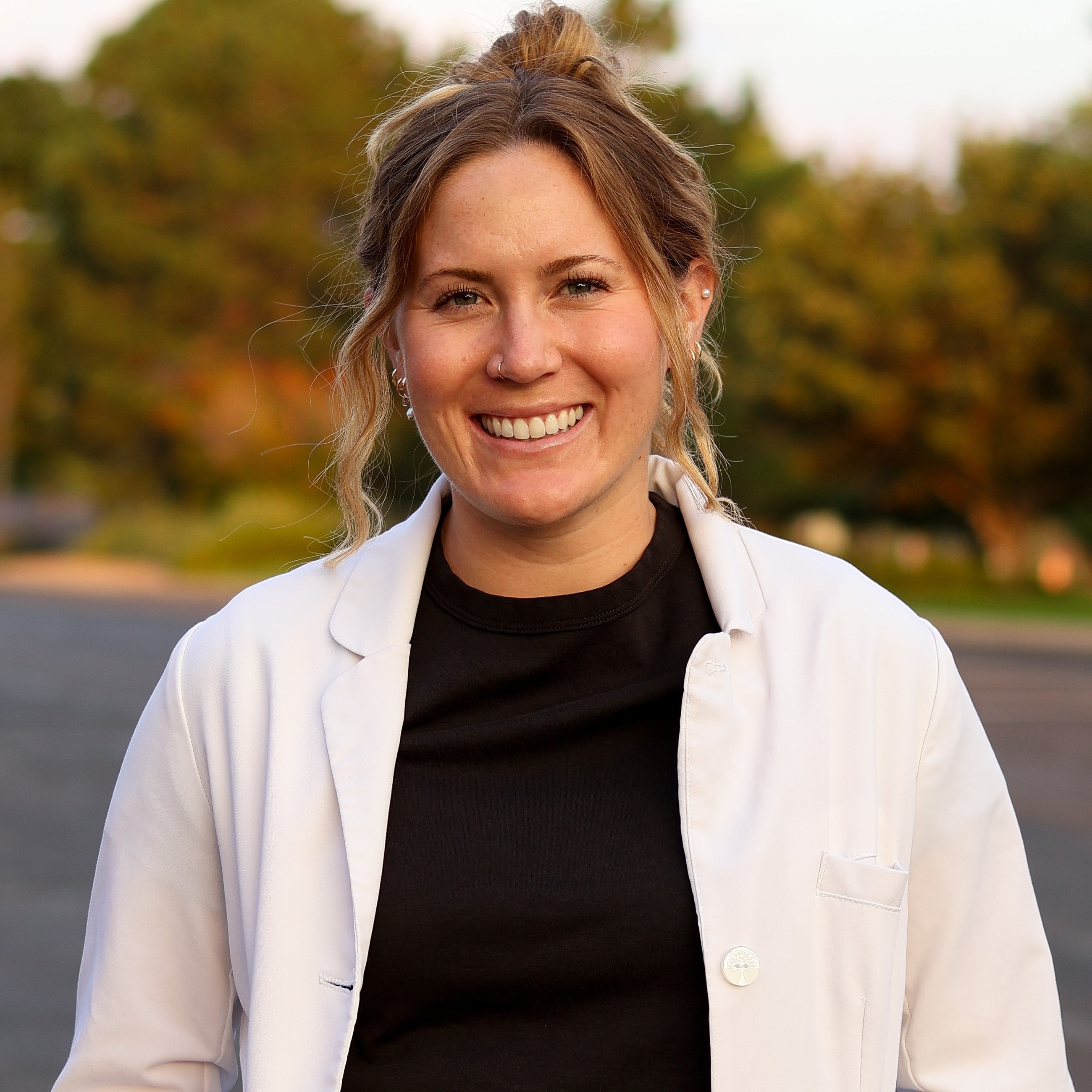 Dr. Jamie Mason | Female Dentist Colorado Smiling in coat